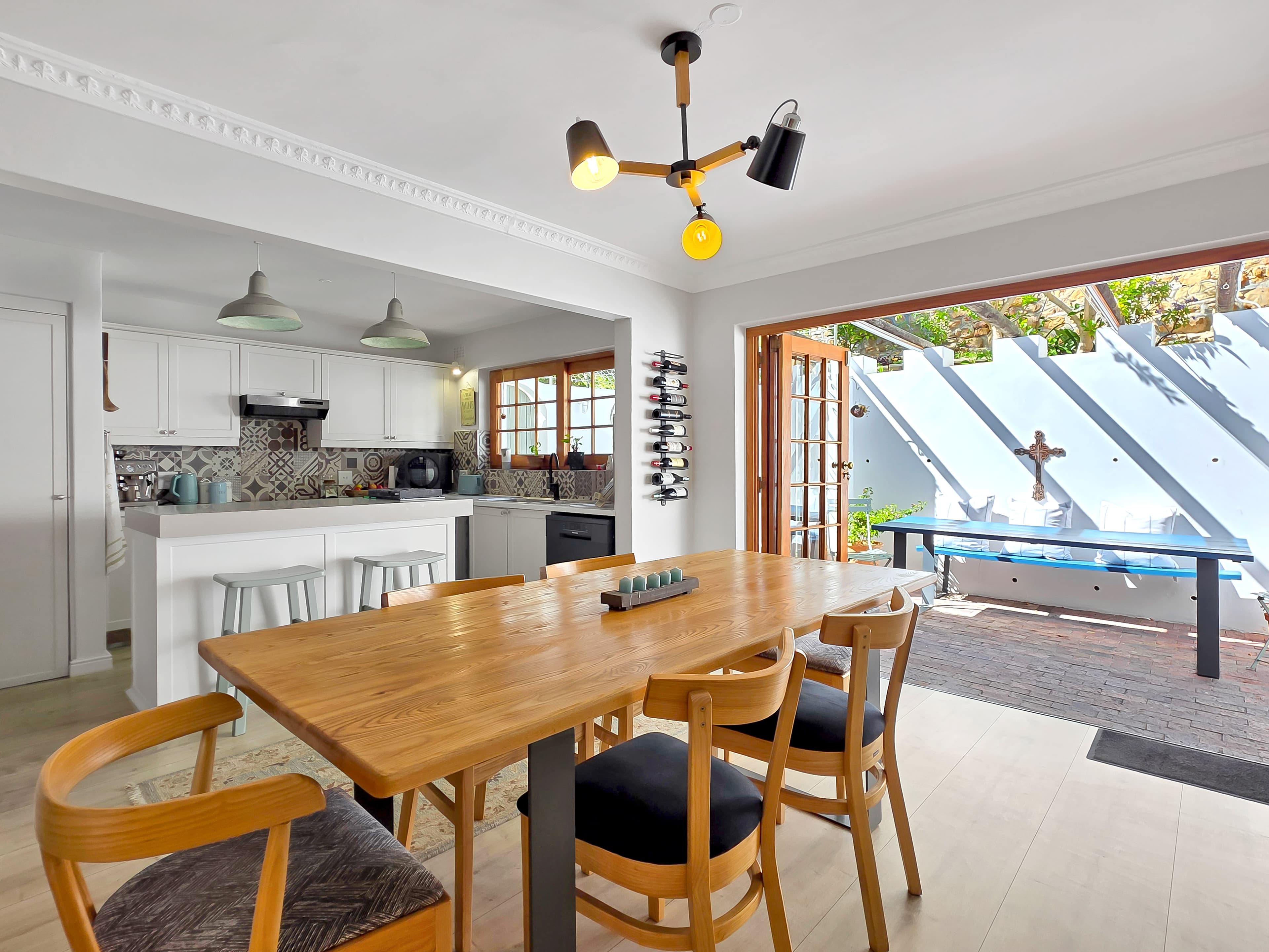 The dining table and outdoor living area.