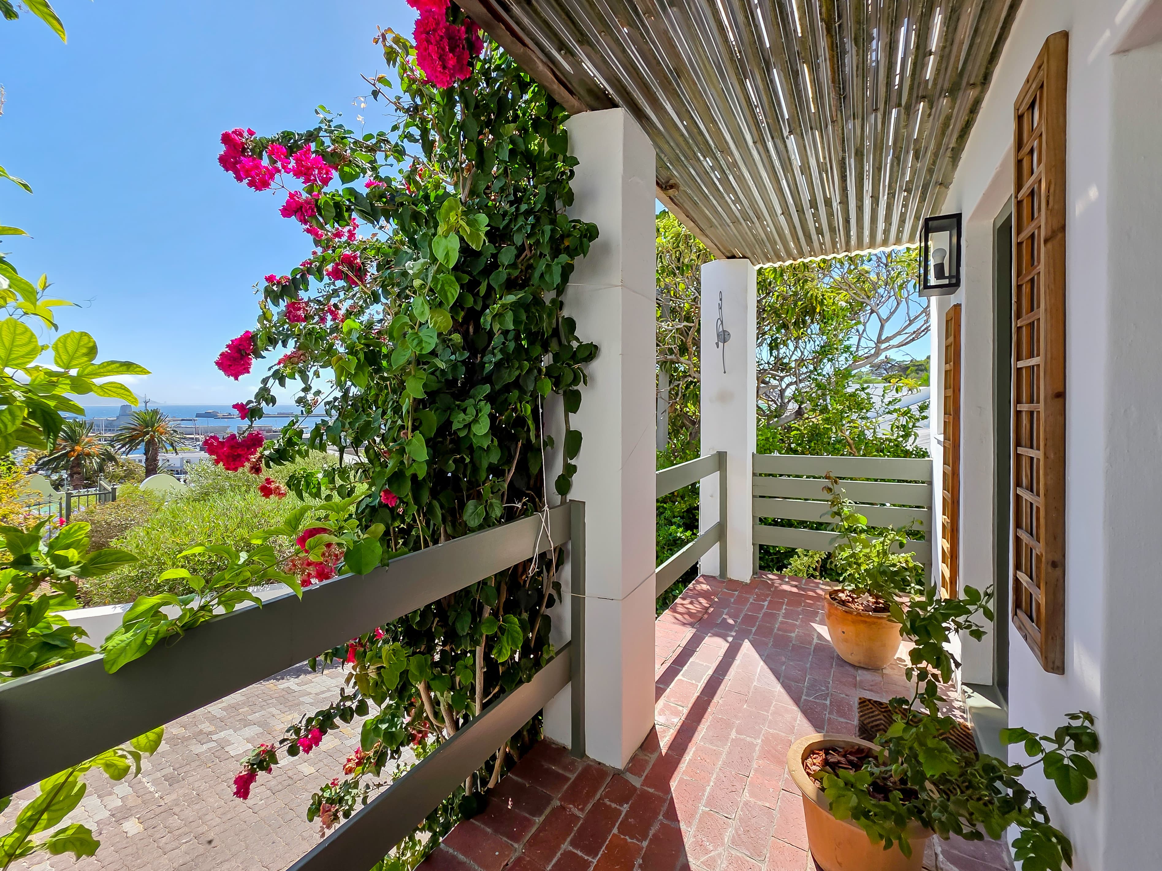 The front door overlooks the harbour, village and yacht basin just below.