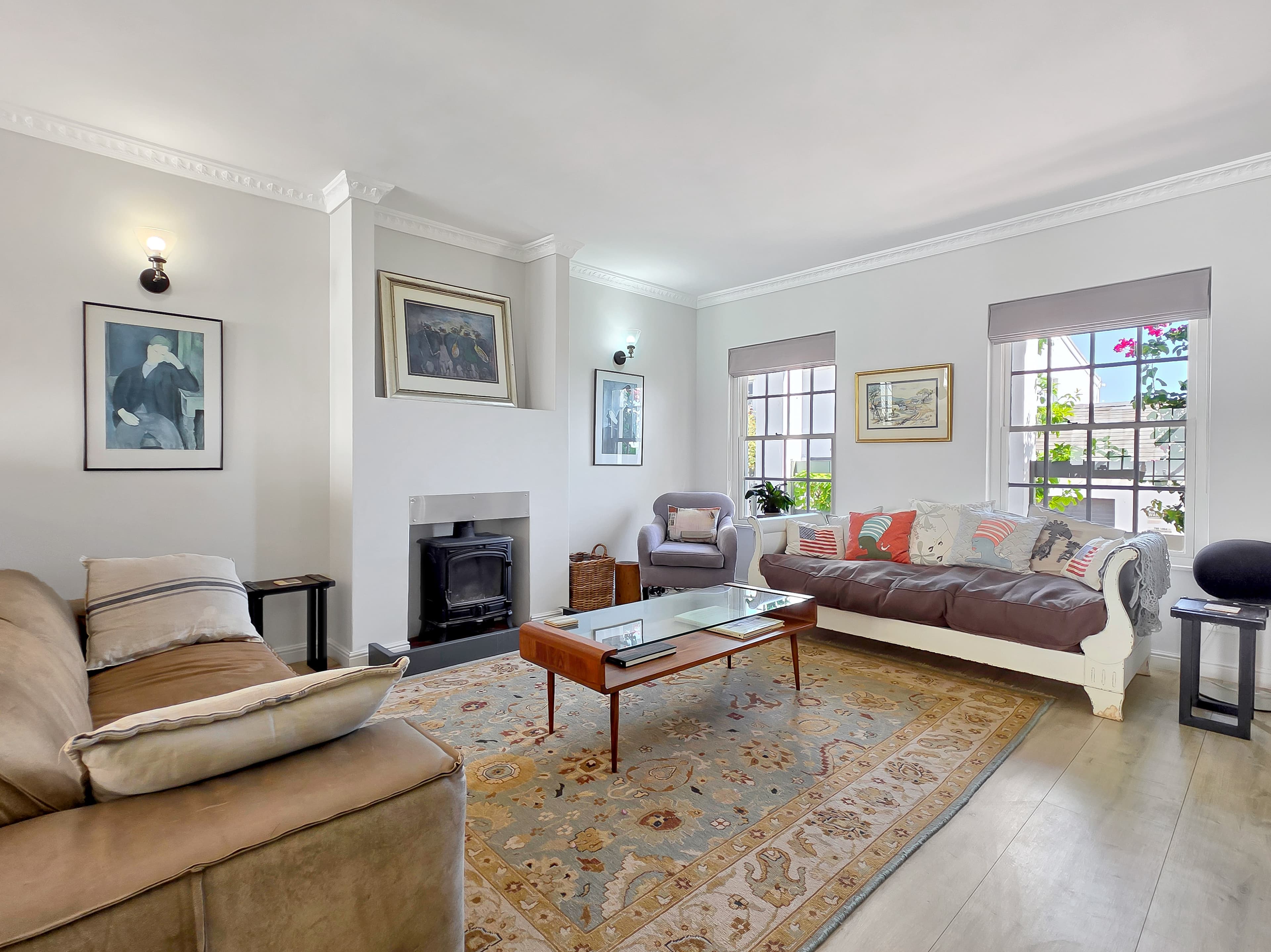 The living room with Thomas Street beyond, facing North towards the bay.